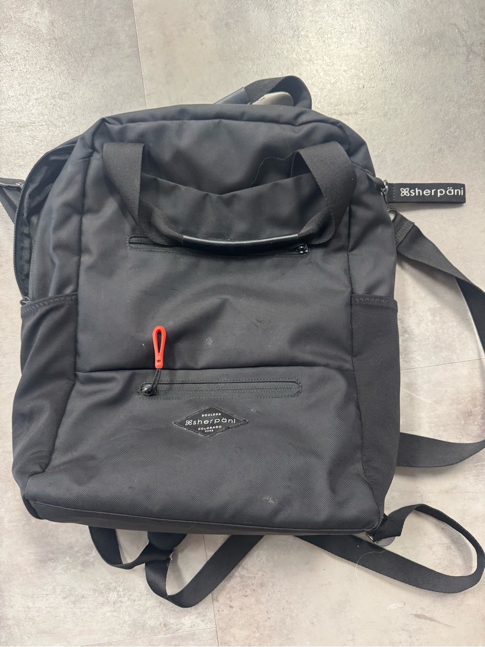 Sherpani Black Backpack with Red Zipper Pull